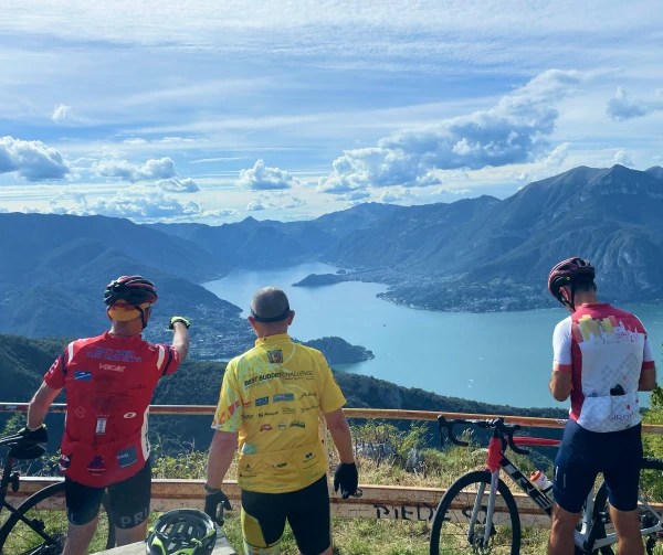 Cyclists overlooking Lake Como from Passo Agueglio
