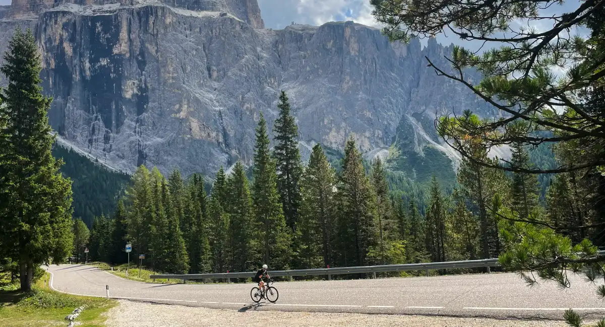 Cyclist riding the Sella Ronda loop in the Dolomites