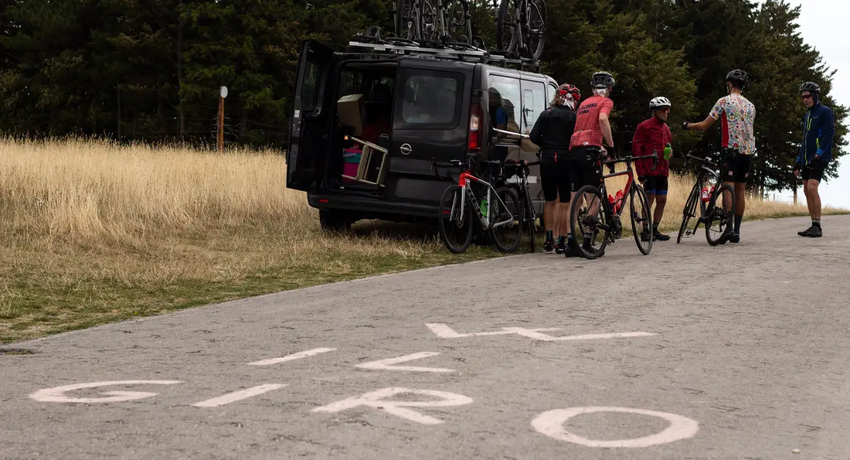 Cyclists and support van at the top of the Blockhaus climb in the Majella mountains
