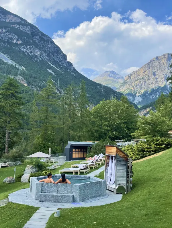 Relaxing in the Roman baths of Bormio surrounded by alpine peaks — the perfect post-ride reward