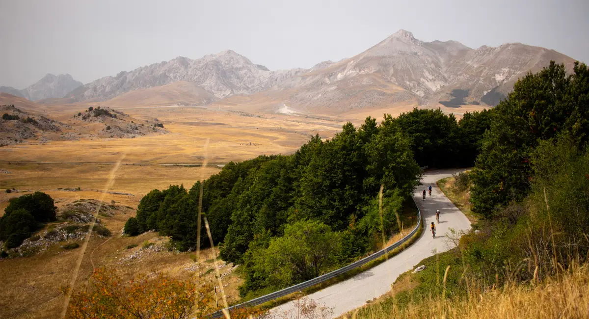 E-bikers crossing the wide plateau of Campo Imperatore in the Gran Sasso National Park