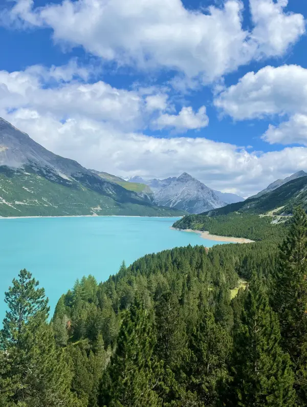 Turquoise waters of Cancano Lakes surrounded by mountains on the E-bike the Alps tour