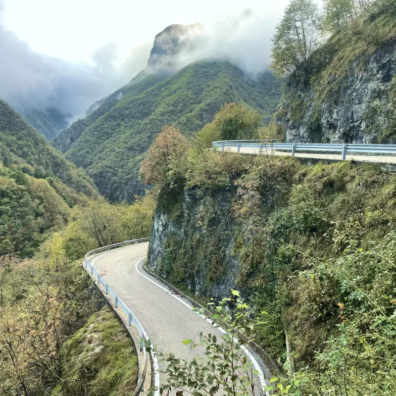 Winding mountain road leading up to the Asiago Plateau