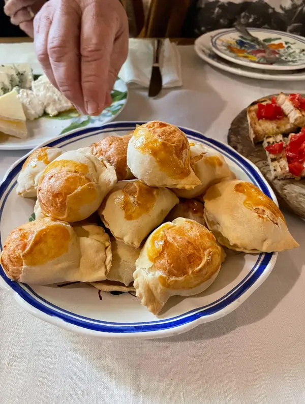 Plate of homemade fiadoni, a traditional Abruzzo pastry enjoyed during the E-Bike Tour