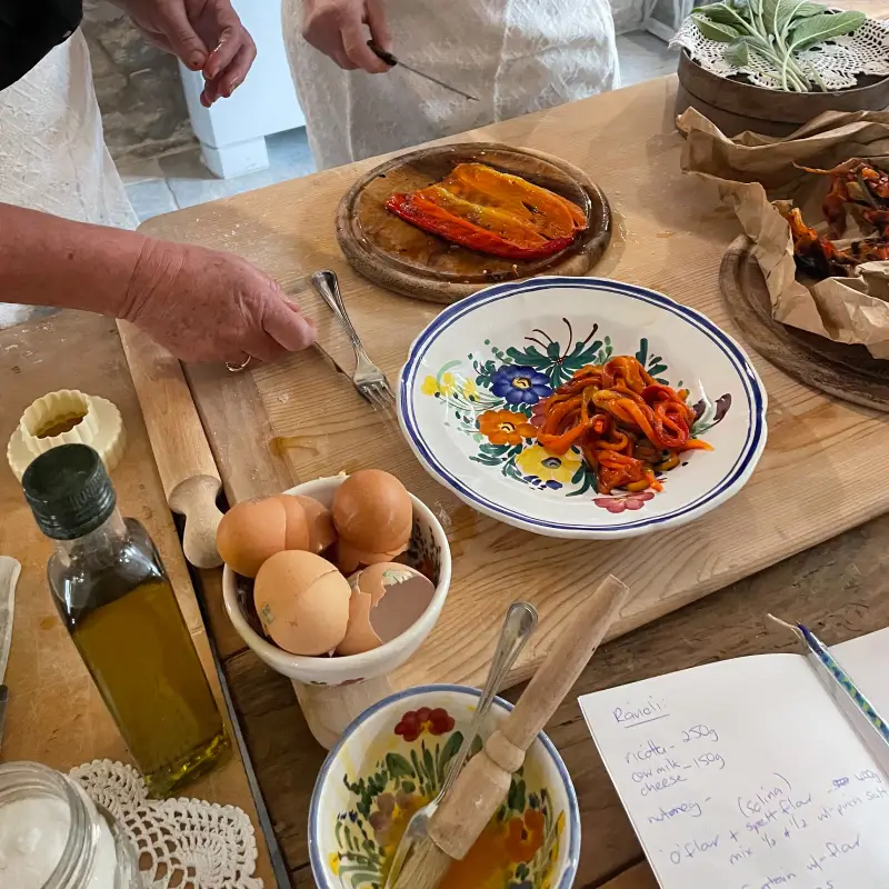 Fresh ingredients and handwritten notes during Giulia’s cooking class in Abruzzo