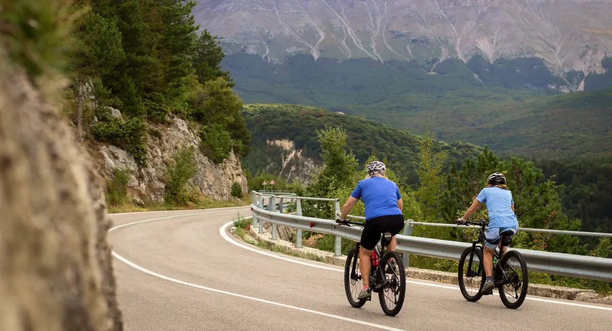 Cyclists riding through the quiet mountain roads of Majella National Park in Abruzzo