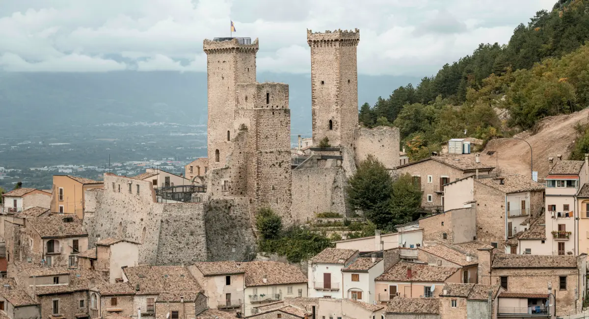 The medieval towers of Pacentro village surrounded by mountains in Abruzzo