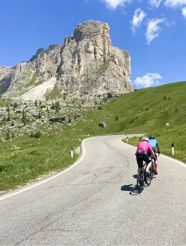 Cyclists climbing the Passo Giau, one of the most epic Dolomites ascents