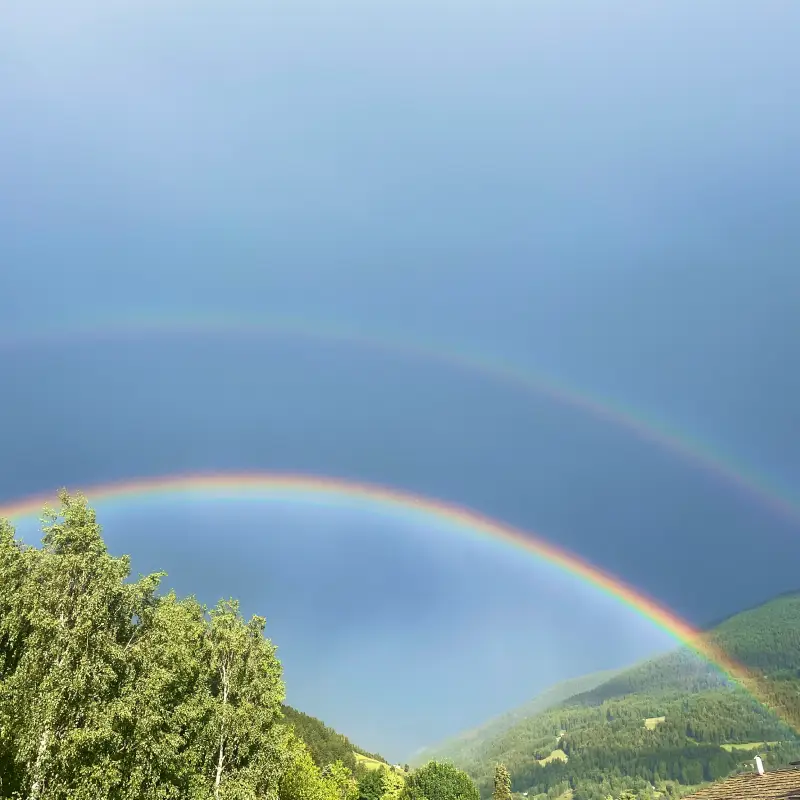 Double rainbow over the Alps — the perfect farewell moment of the Stelvio and Dolomites Bike Tour