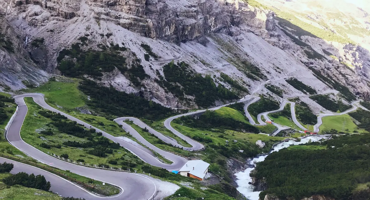 Aerial view of the iconic hairpin turns of the Stelvio Pass, one of the Alps’ most legendary climbs