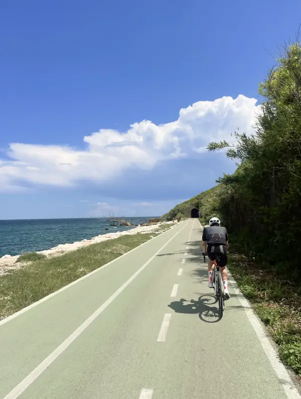 Cyclist riding along the Adriatic coast on the Via Verde bike path near the Trabocchi Coast in Abruzzo