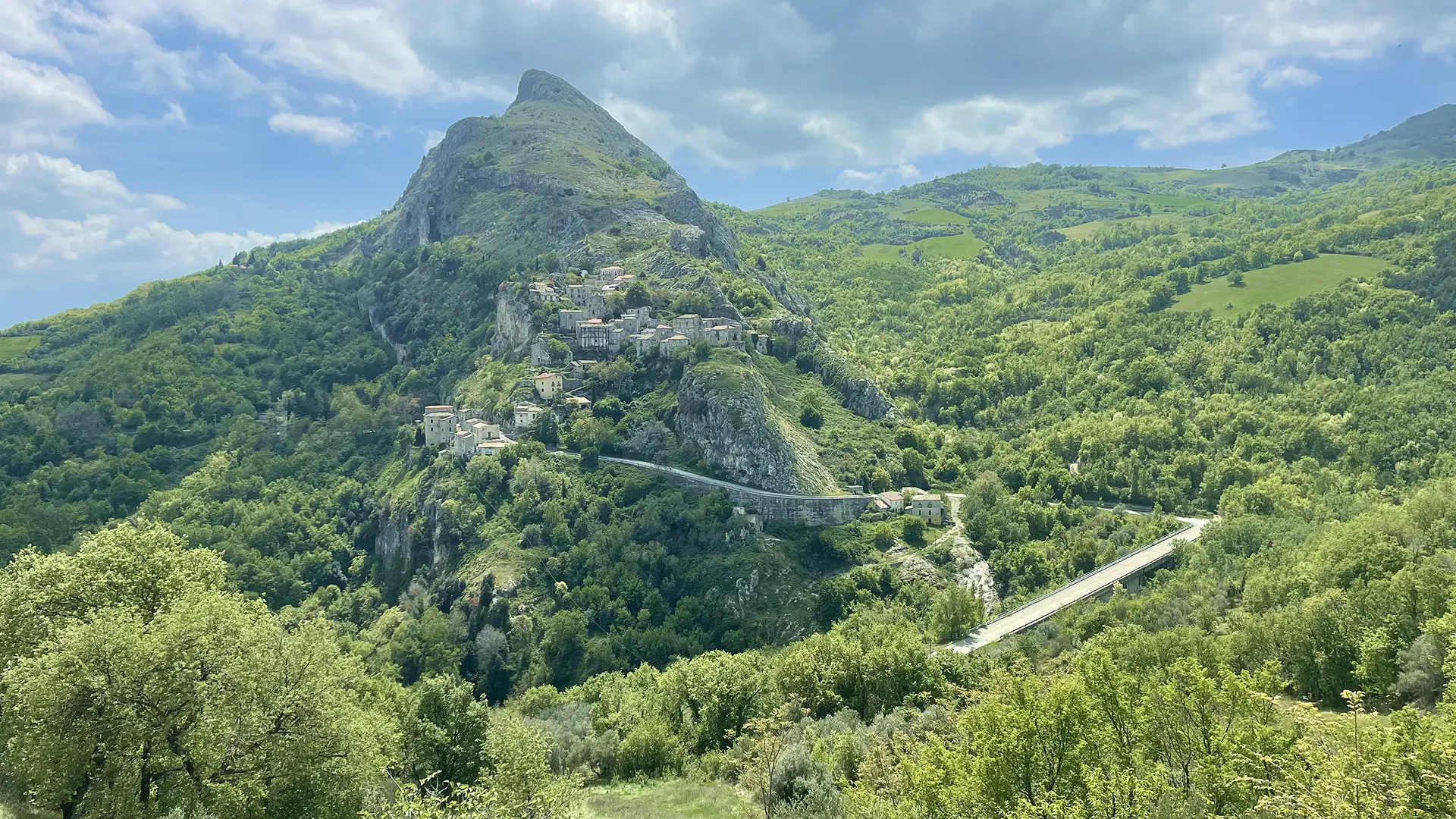 beautiful road in the green mountains of Abruzzo, a cycling destination in Italy