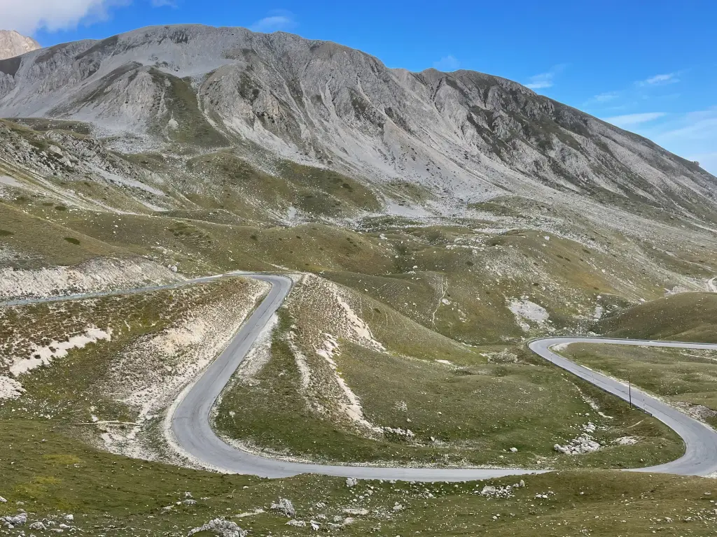 Panoramic view of the winding road climbing towards Campo Imperatore in the Gran Sasso mountains