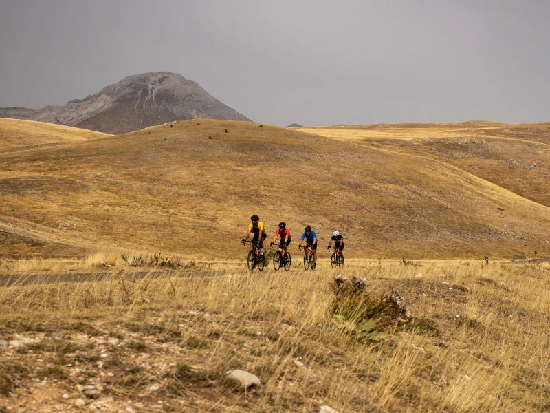 Cyclists riding to Campo Imperatore during the Abruzzo bike tour