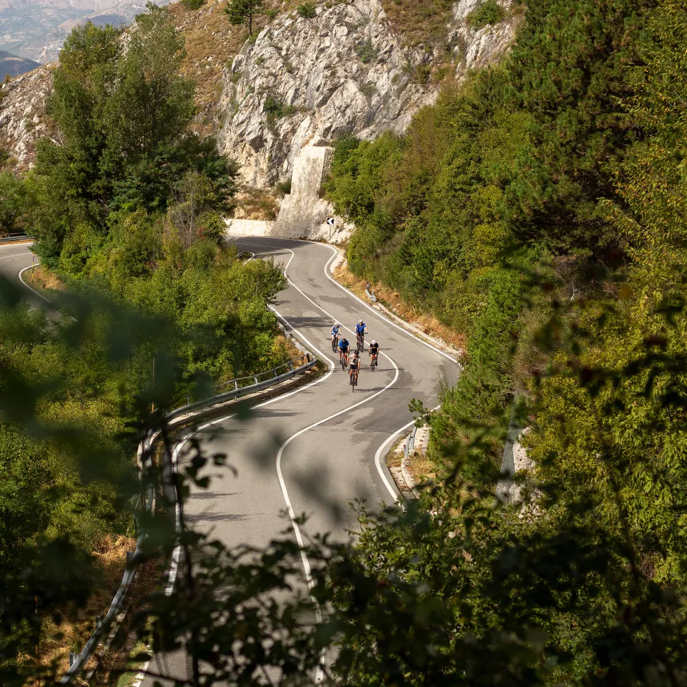 cyclists on the climb of Passo San Leonardo during a bike tour in Abruzzo