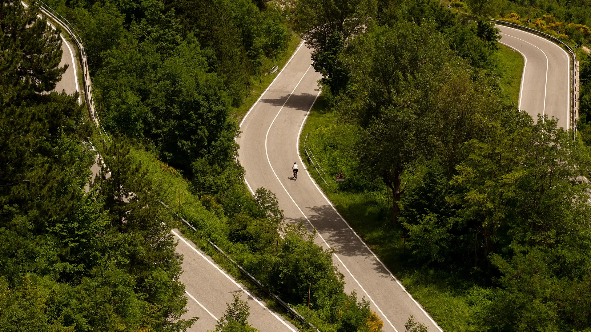 Cyclist on the switchbacks of Passo San Leonardo in Abruzzo
