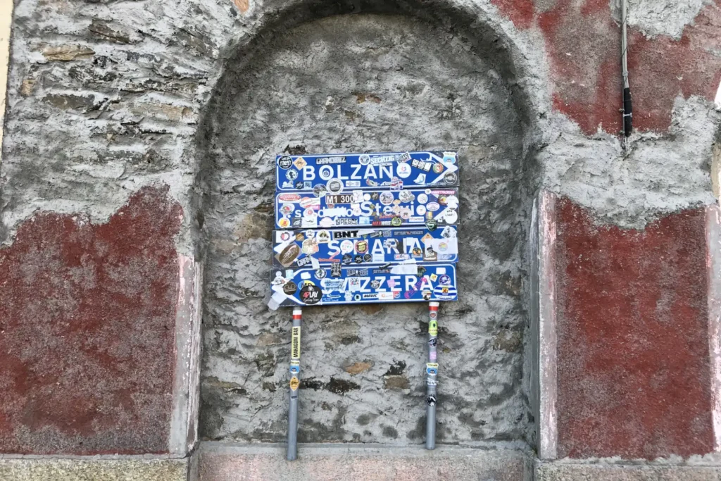 Iconic Stelvio Pass sign at the summit